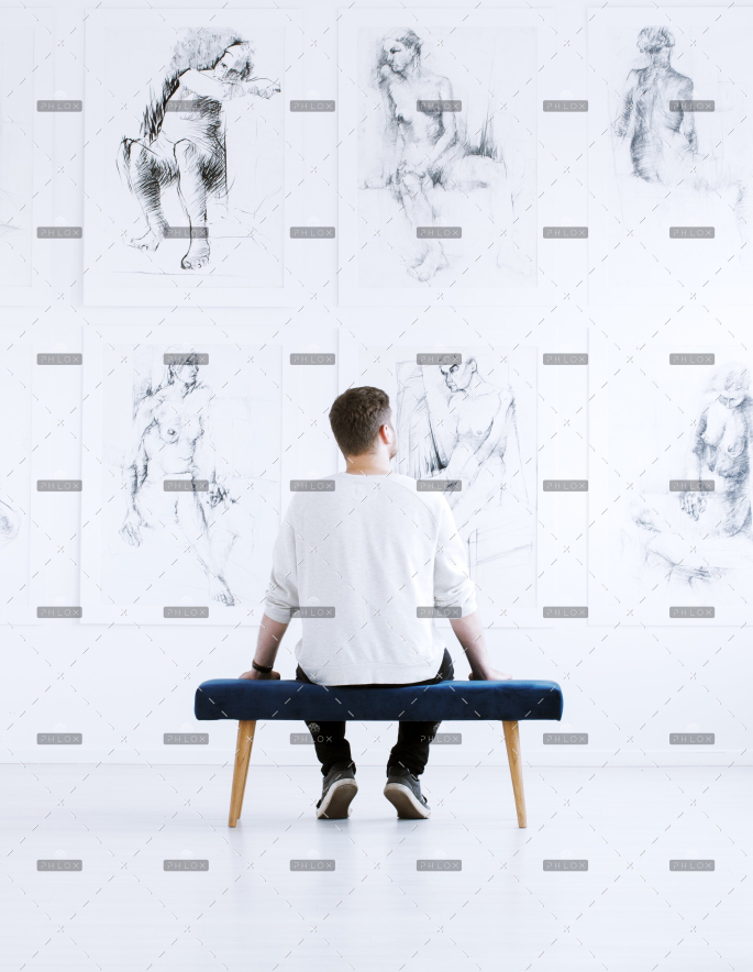 demo-attachment-218-man-relaxing-in-art-gallery-P9C4CGY-1